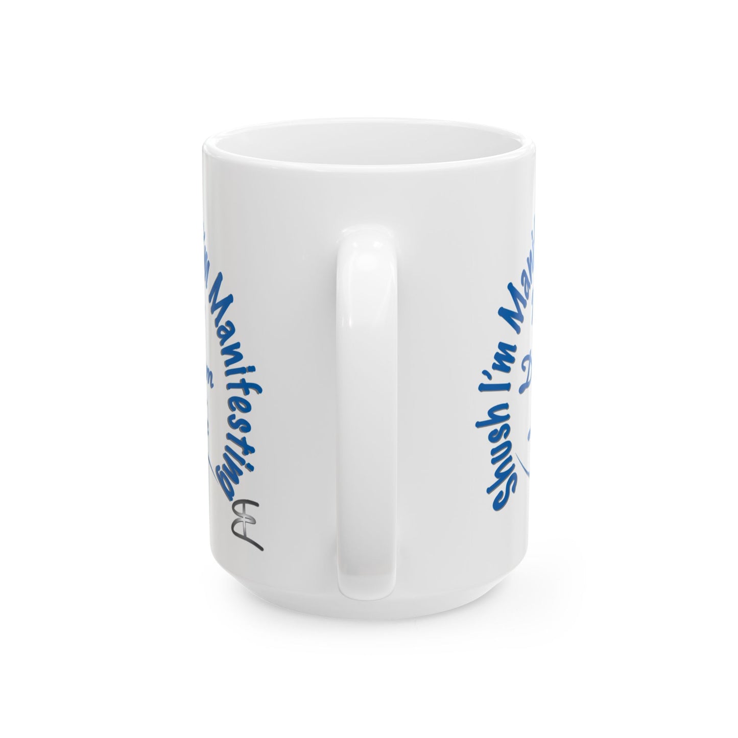 White ceramic mug with the text 'Shush, I'm Manifesting My Dream Life'