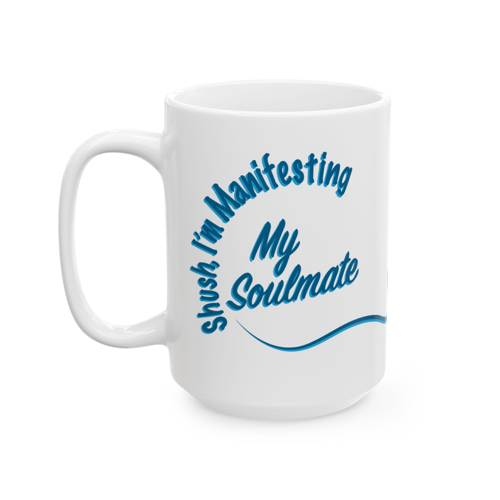 A white ceramic coffee mug with a blue printed graphic that reads 'Shush, I'm Manifesting My Soulmate' in a stylized script font, shown on a plain white background.
