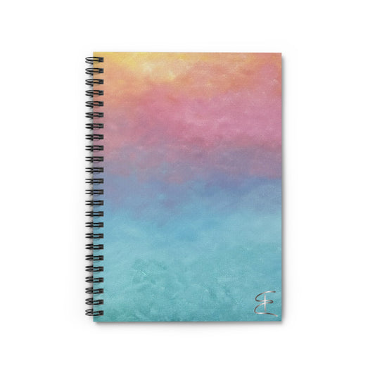 Spiral-bound notebook with a colorful sunrise gradient cover on a white background