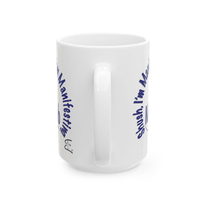 'Shush, I’m Manifesting A New Job' — 15oz ceramic mug back handle view.