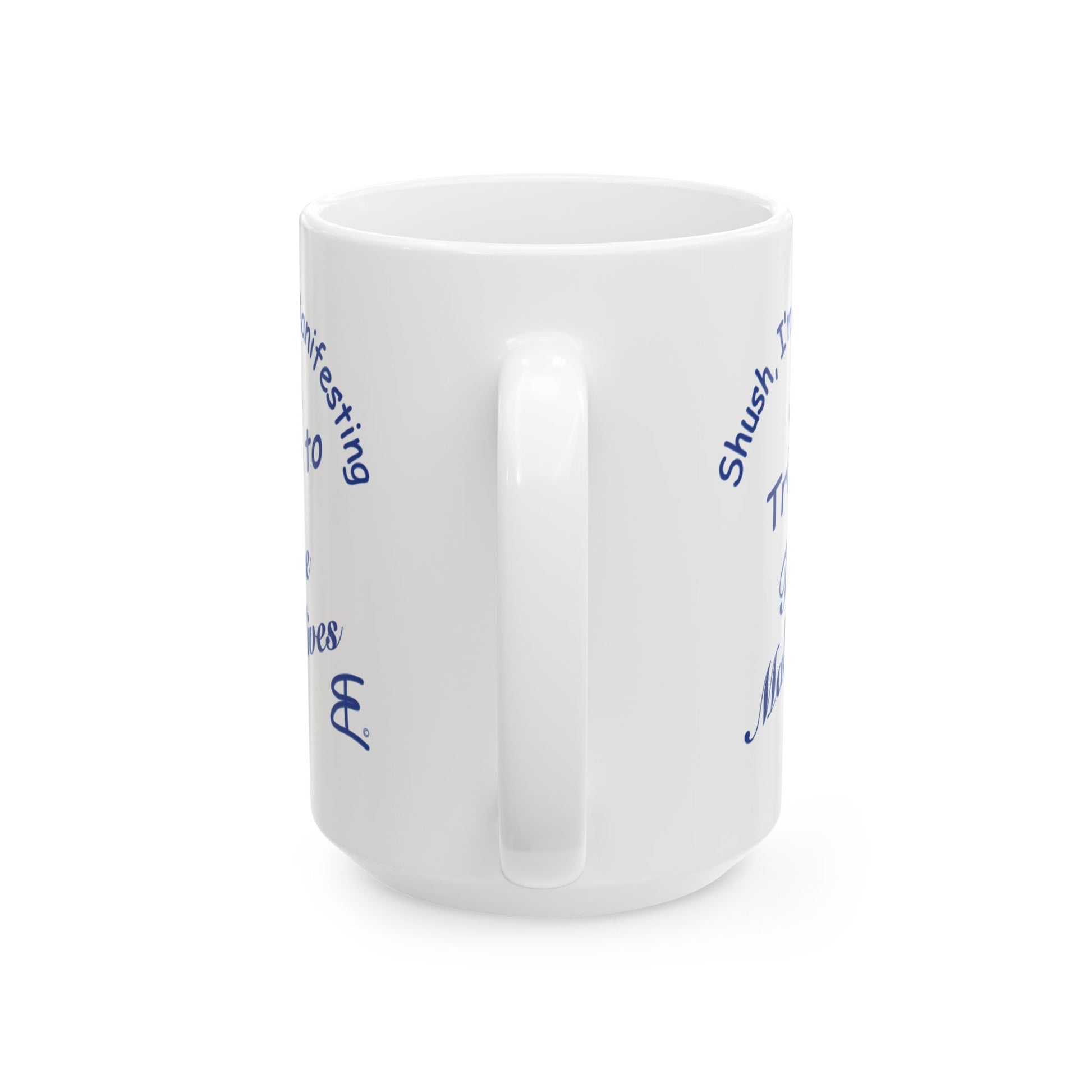 A white ceramic coffee mug with blue text printed on the side, shown from a three-quarters angle against a plain white background.