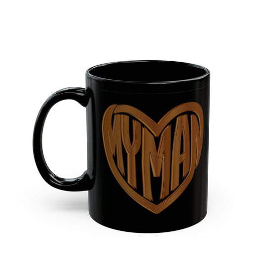 A glossy black ceramic mug featuring a Wood look heart graphic with the word 'MYMAN' inside, set against a plain white background.