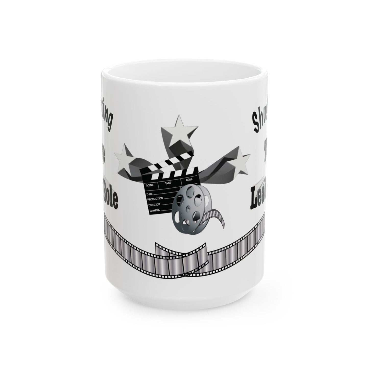 A white ceramic mug featuring a black and gray graphic design with a clapperboard, stars, film reel, and filmstrip motif, shown on a plain white background.