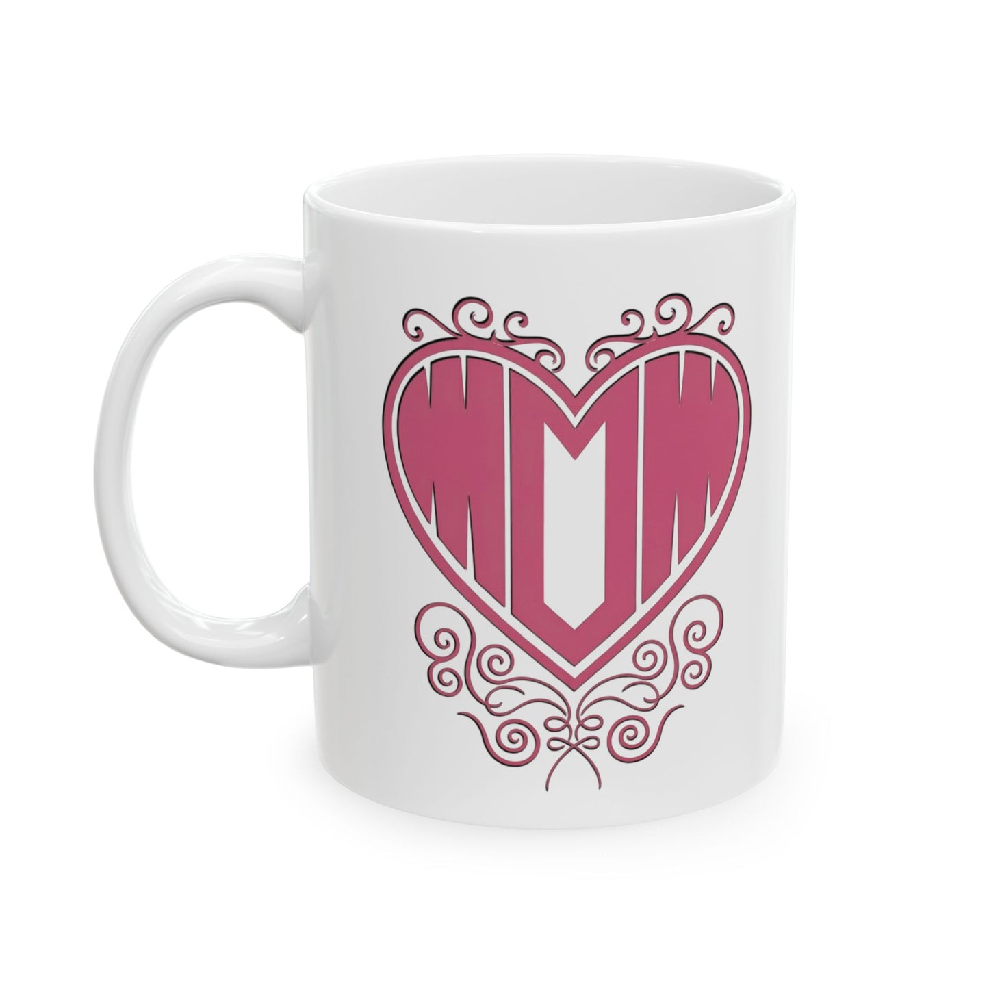 White ceramic mug with "Mom" printed in pink text inside a heart with decorative filigree, on a white background.