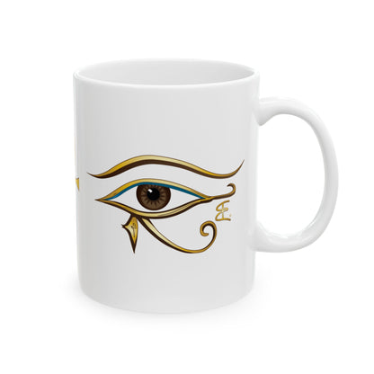 A white ceramic mug featuring a stylized Egyptian Eye of Horus graphic printed on the side, set against a plain white background.