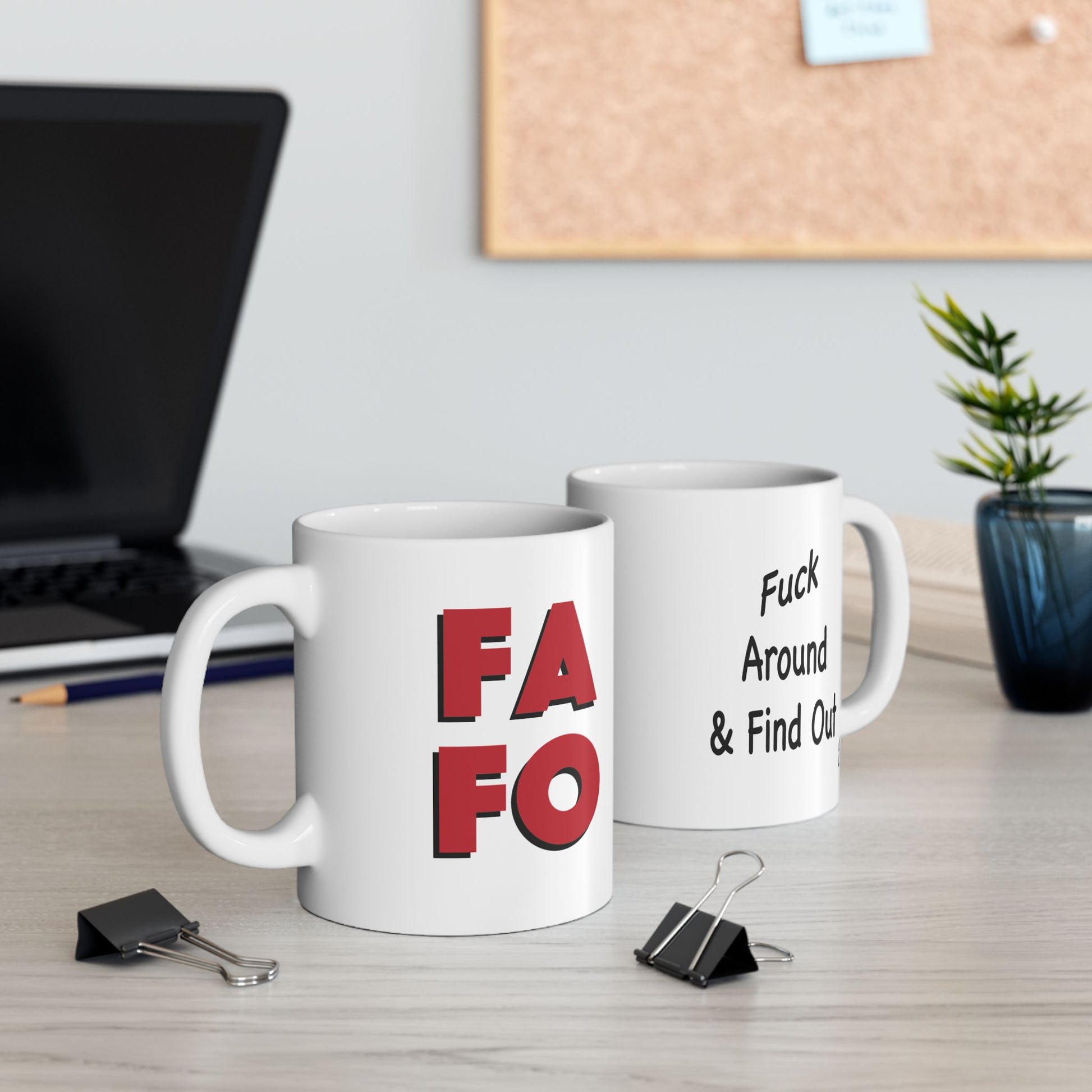 FAFO coffee mug displayed on a desk showing both sides, with "FAFO" on one side and "Fuck Around & Find Out" on the other.