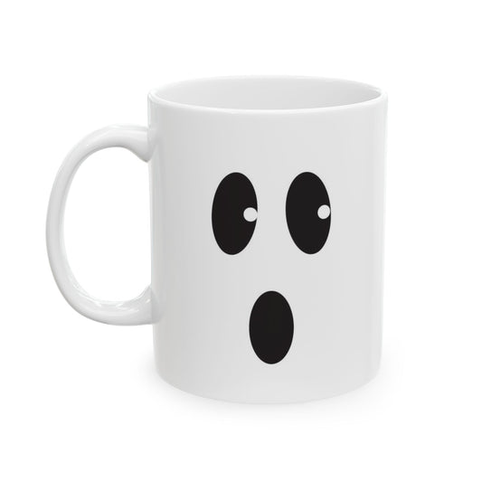 A white ceramic mug with a cartoon ghost face graphic on the front, set against a plain white background.