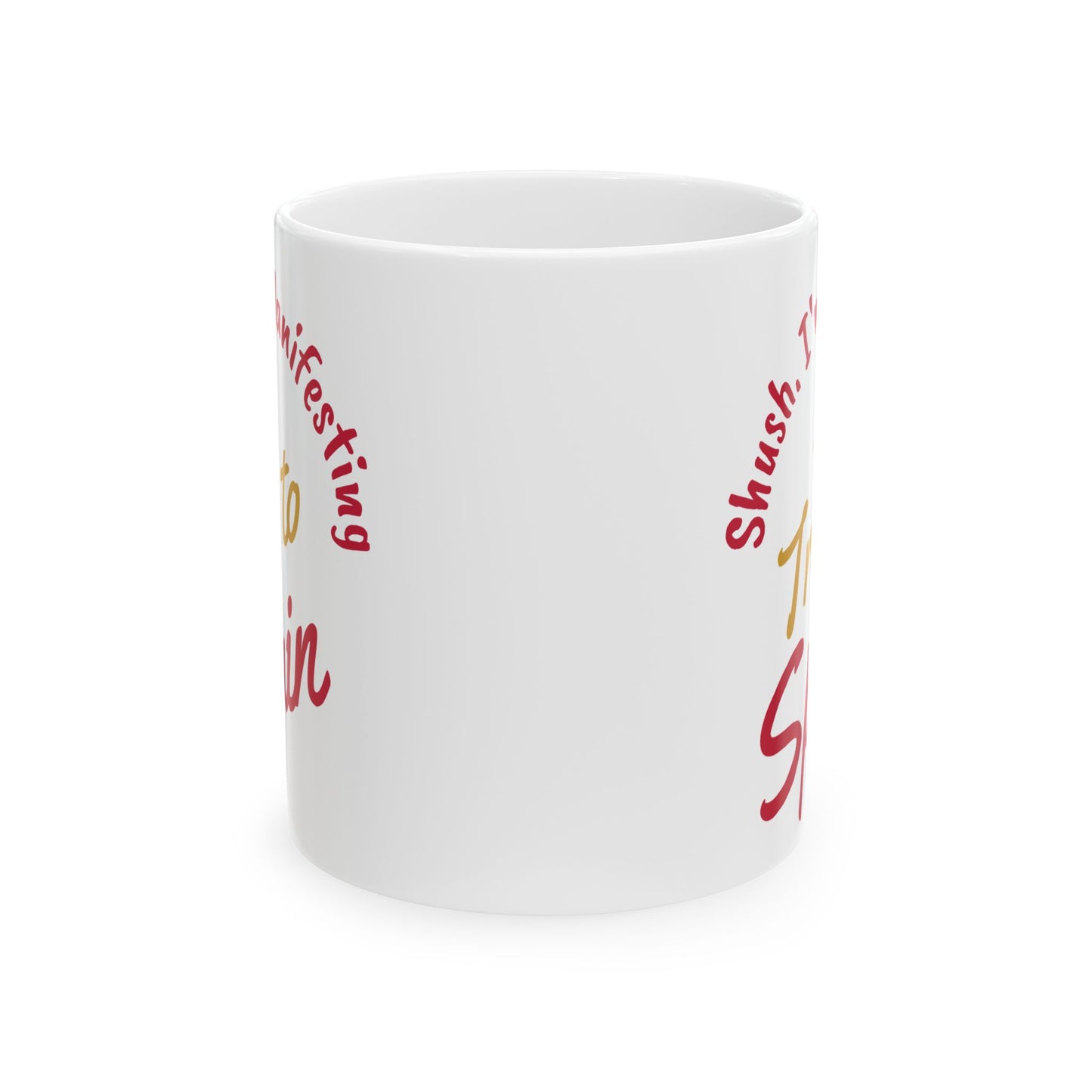 'Shush I'm Manifesting A Trip to Spain' ceramic mug front center view on white background.