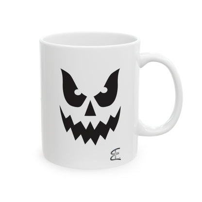 A white ceramic mug featuring a black graphic of a spooky ghost face, set against a plain white background.