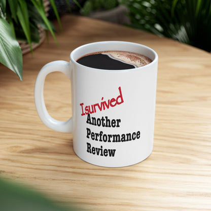Sarcastic mug that says 'I Survived Another Performance Review'