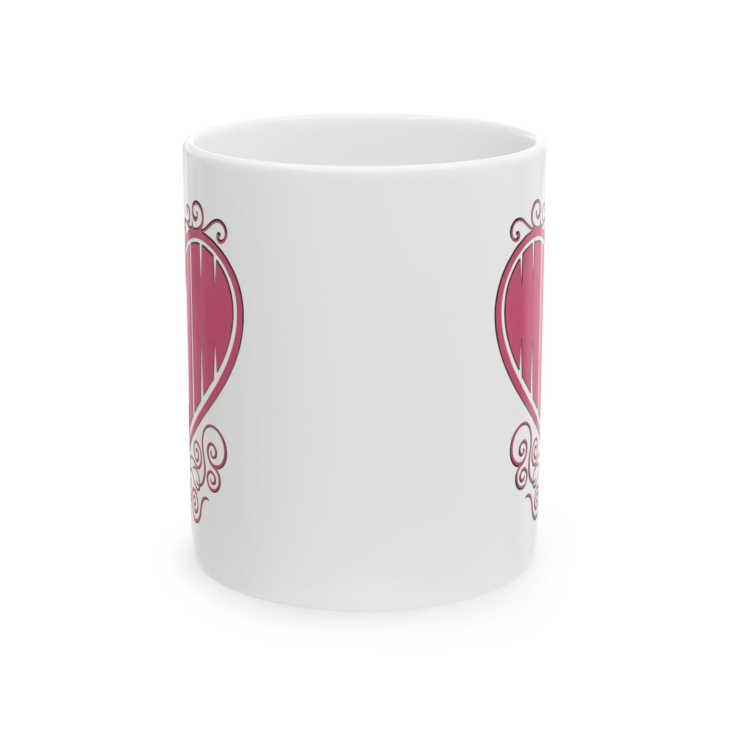 Front center view of white ceramic mug with "Mom" printed in pink text inside a heart with filigree, artwork.