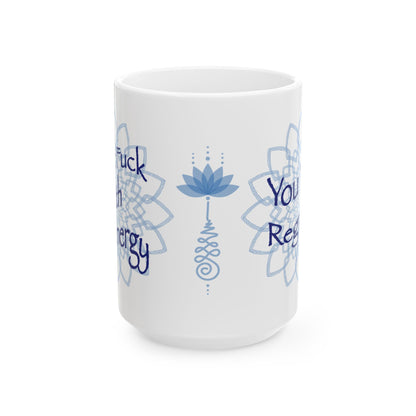 White ceramic mug with blue lotus flower and mandala artwork, showing partial text on both sides.