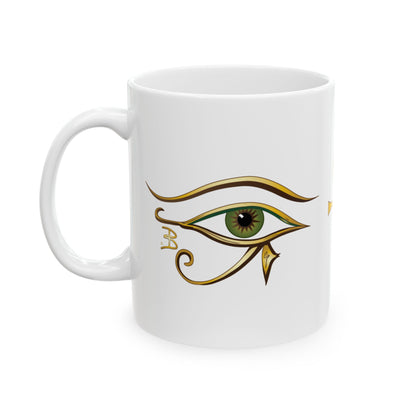 A white 11oz ceramic coffee mug featuring a stylized Green Egyptian Eye of Horus design in gold, with a green iris, set against a plain white background.