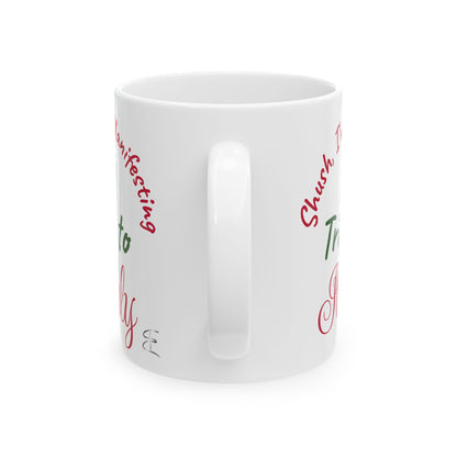 White mug with red and green text on a white background