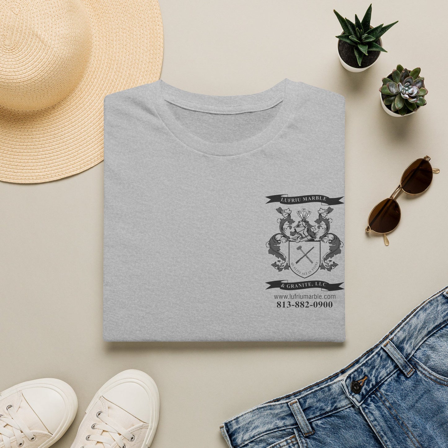 Folded light gray Lufriu Logo Softstyle T-Shirt displaying the company logo and premium cotton fabric.