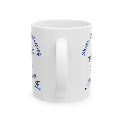 A white ceramic mug with blue printed text wrapping around the side, shown on a clean white background.