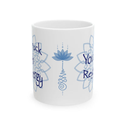 White ceramic mug featuring a blue lotus flower, mandala artwork, and partial text wrapping around the sides.