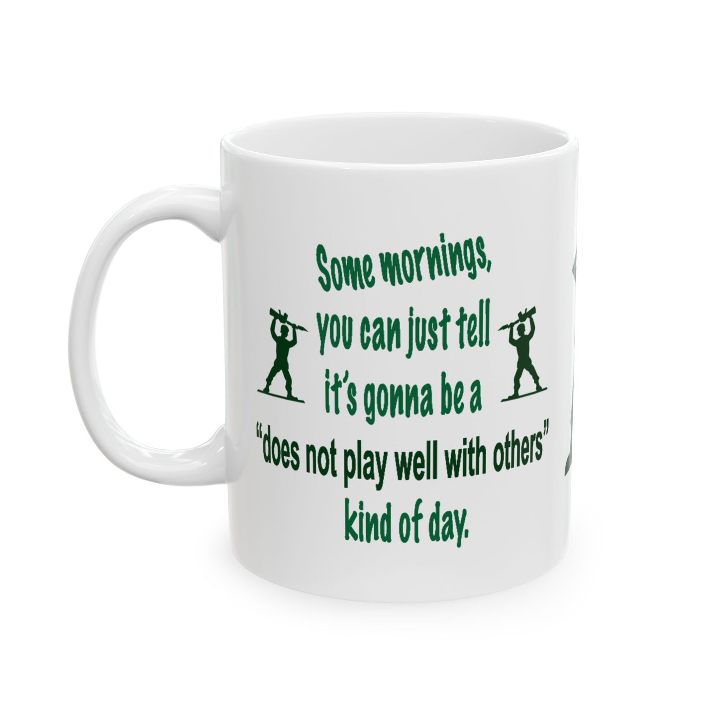 A white ceramic mug with a green printed quote and Soldier silhouettes on a plain white background.