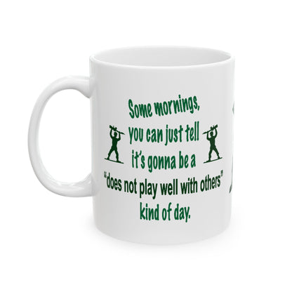 A white ceramic mug with a green printed quote and Soldier silhouettes on a plain white background.