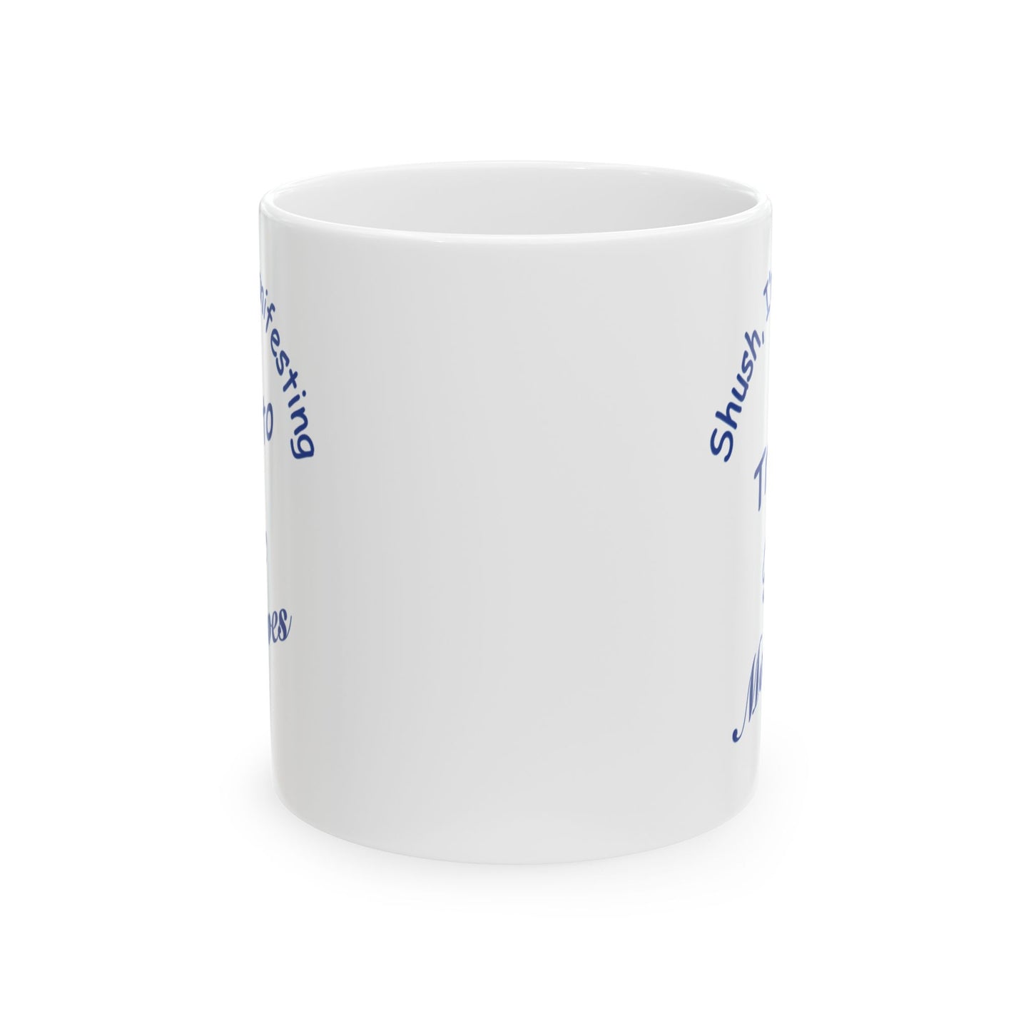 A white ceramic mug with blue text partially visible on the sides, shown against a plain white background.