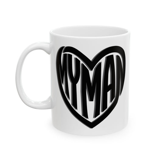 A white ceramic mug featuring a black heart-shaped graphic with the word 'MYMAN' in stylized lettering, shown against a plain white background.