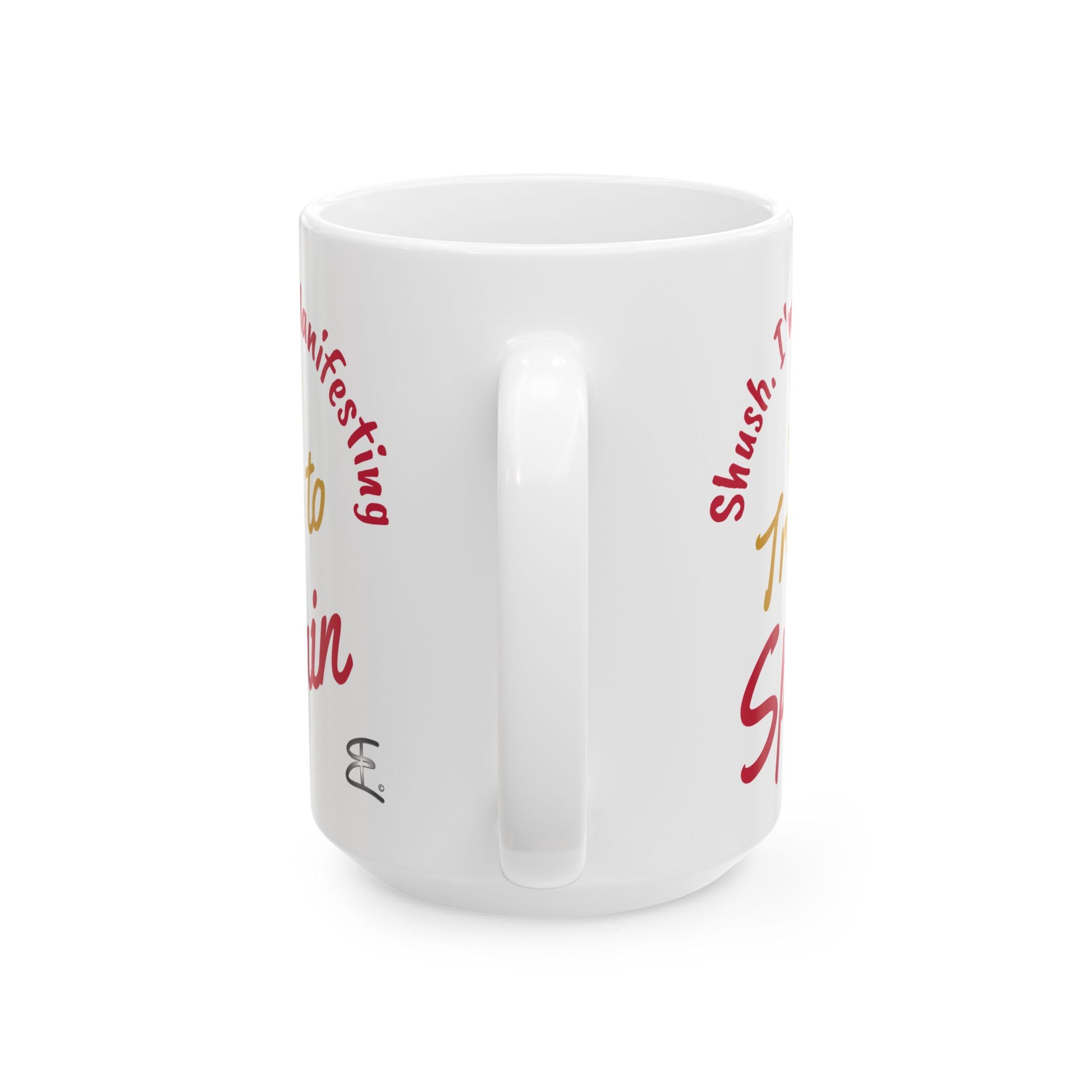 'Shush I'm Manifesting A Trip to Spain' 15oz ceramic mug handle back view on white background.