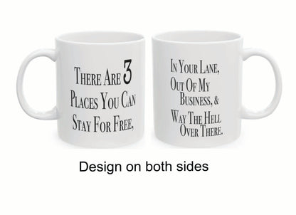 Double-sided sarcastic mug that says 'There are three places you can stay for free: in your lane, out of my business, and way the hell over there'

