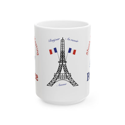 A white ceramic mug featuring a black line art illustration of the Eiffel Tower, two French flags, and blue and red text on a clean white background.