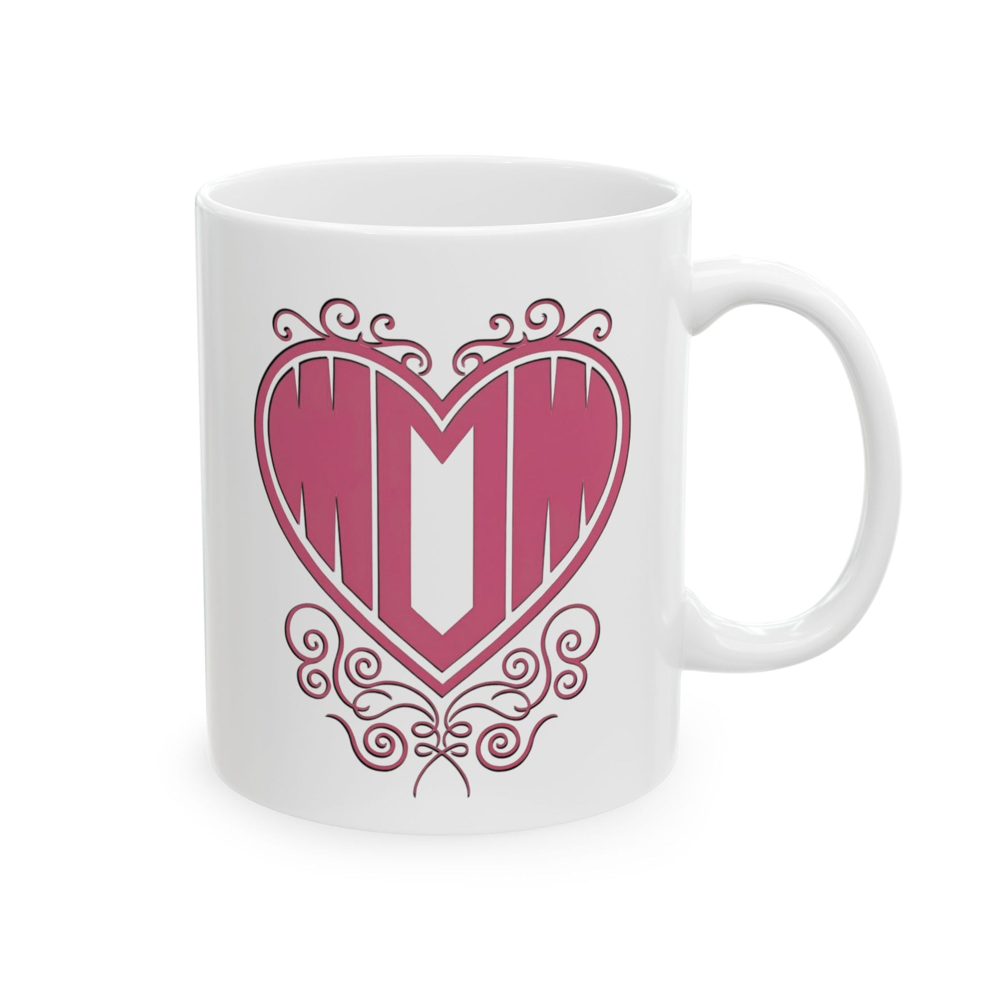 Front view of white ceramic mug featuring "Mom" printed in pink text inside a heart with filigree, on a white background.