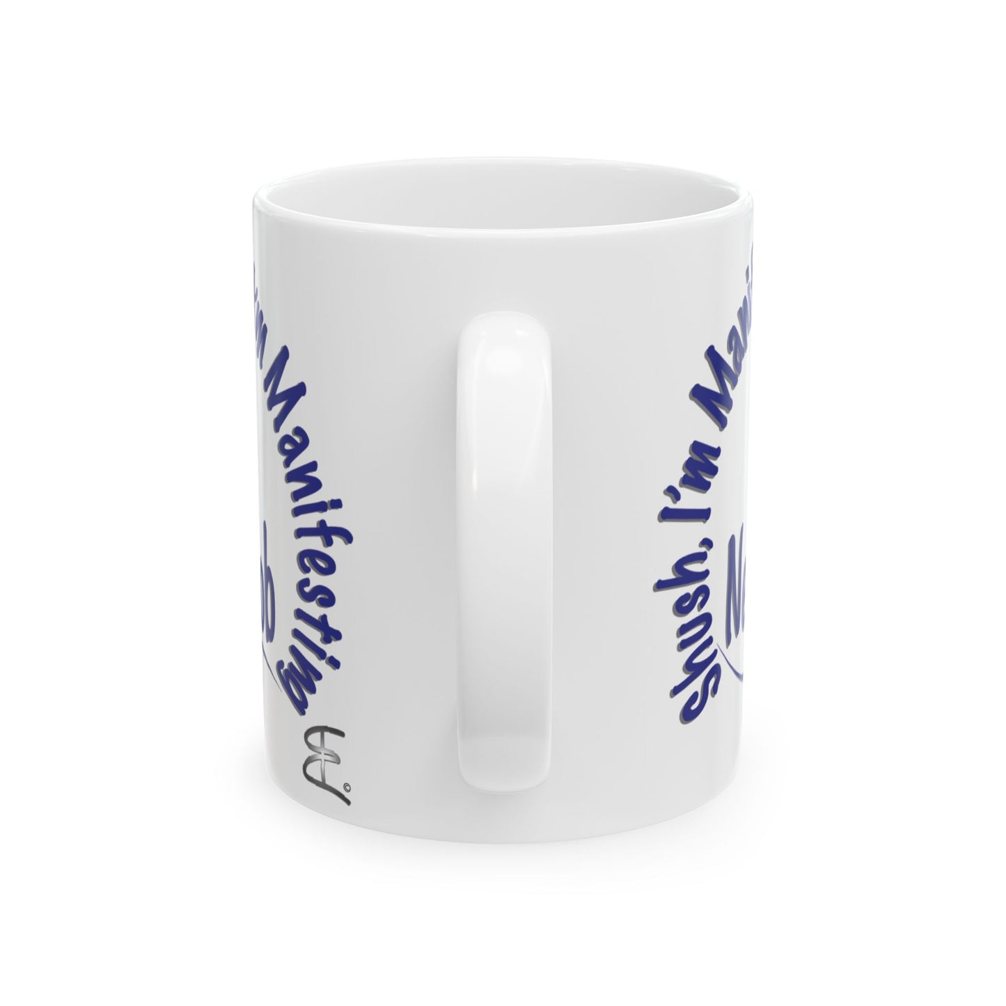 'Shush, I’m Manifesting A New Job' — ceramic mug back handle view.