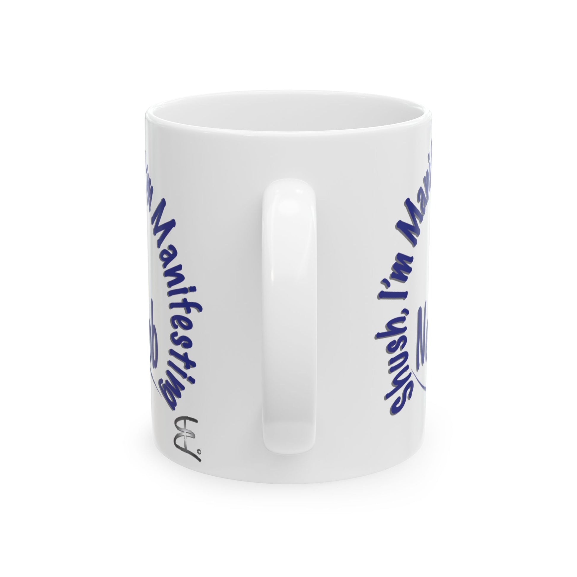 'Shush, I’m Manifesting A New Job' — ceramic mug back handle view.