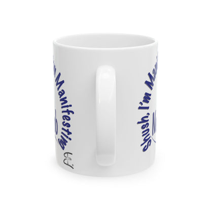 'Shush, I’m Manifesting A New Job' — ceramic mug back handle view.