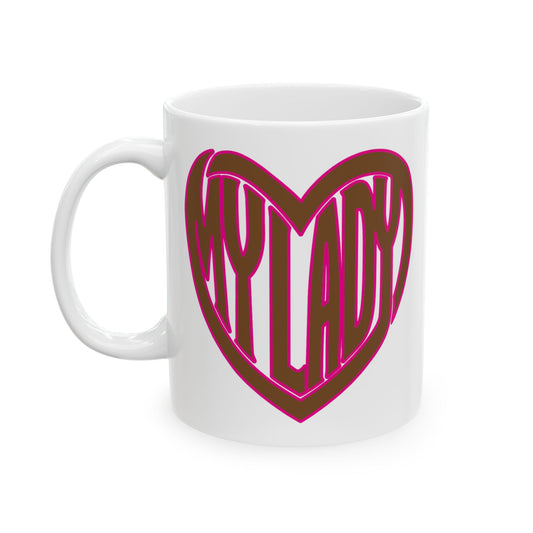 A white ceramic mug featuring a heart-shaped graphic with the word 'MY LADY' in dark brown letters outlined in bright pink, set against a clean white background.