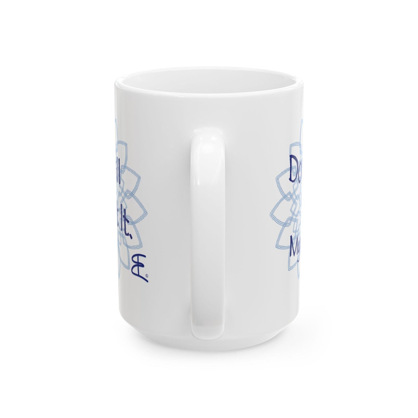 White ceramic mug, angled front view with light blue mandala artwork and partial blue text.