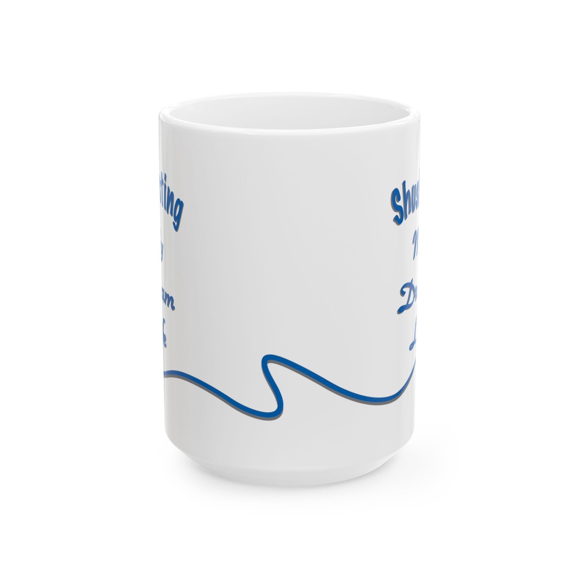 White ceramic mug with the text 'Shush, I'm Manifesting My Dream Life'


