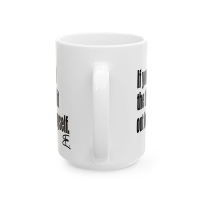 A white ceramic coffee mug with black printed text on the side, shown against a plain white background.