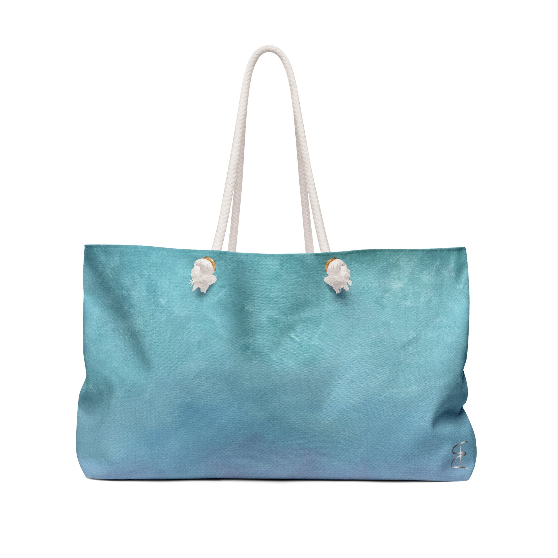 Back view of the Artful Ombre Sunrise Weekend Bag with rope handle on white background.