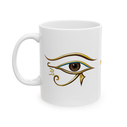 A white ceramic mug featuring a stylized Egyptian Eye of Horus graphic printed on the side, set against a plain white background.