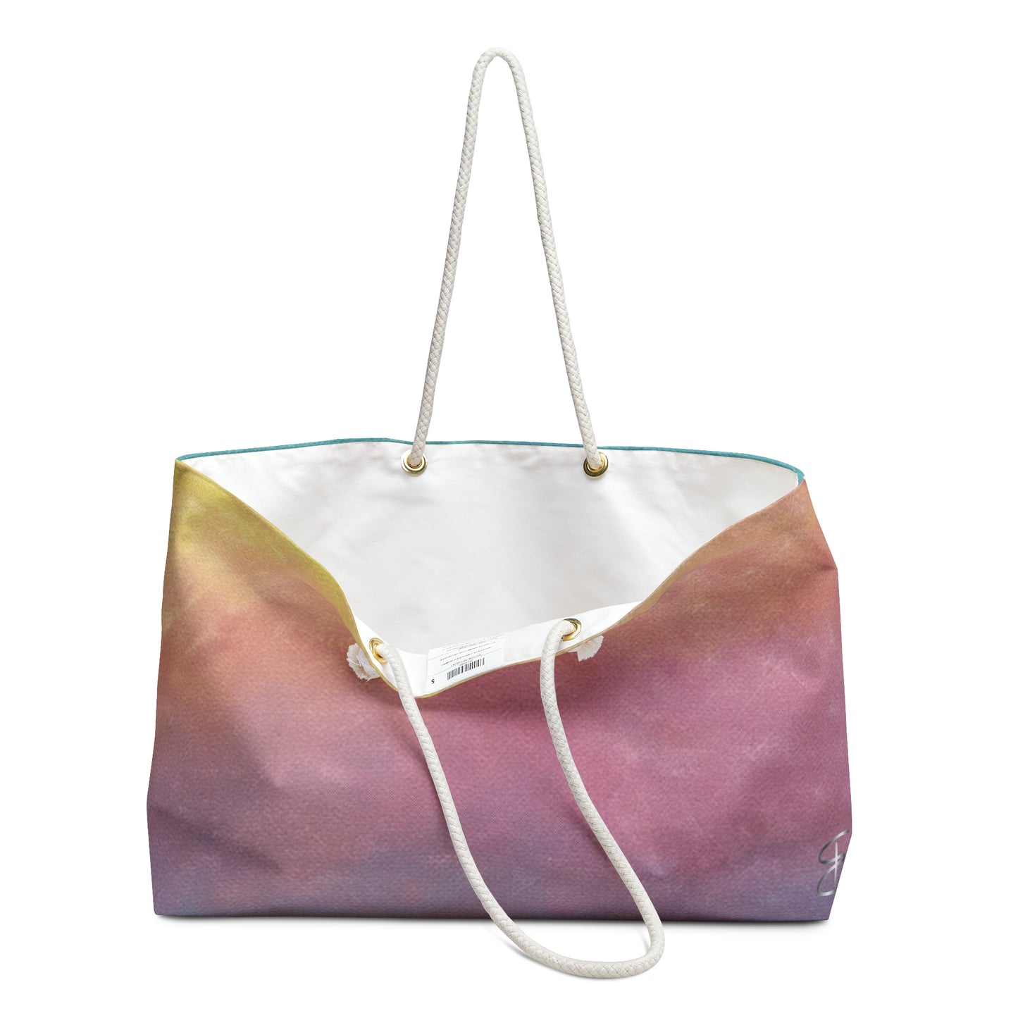 Front view of Artful Ombre Sunrise Weekend Bag with rope handle, bag is open so that you can see the liner.