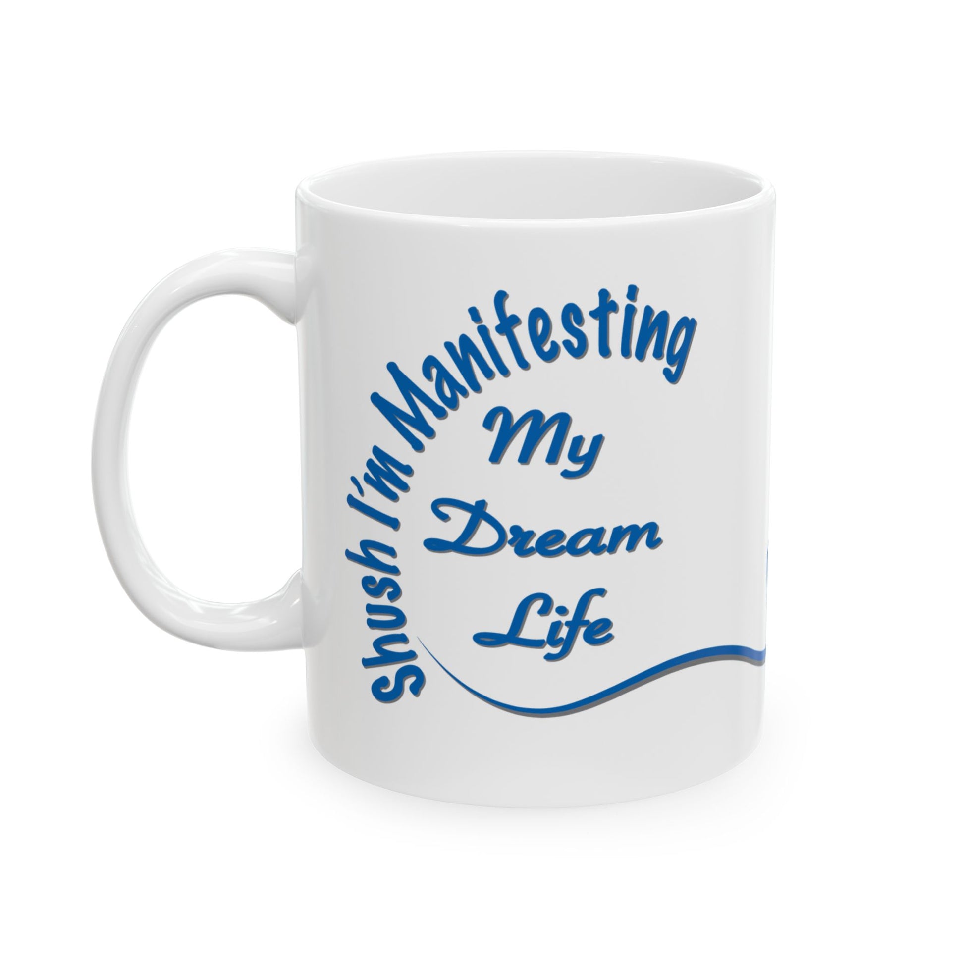 White ceramic mug with the text 'Shush, I'm Manifesting My Dream Life'

