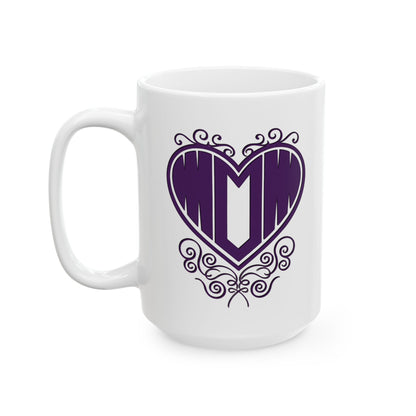 Front view of white ceramic mug featuring "Mom" printed in purple text inside a heart with filigree, on white background.