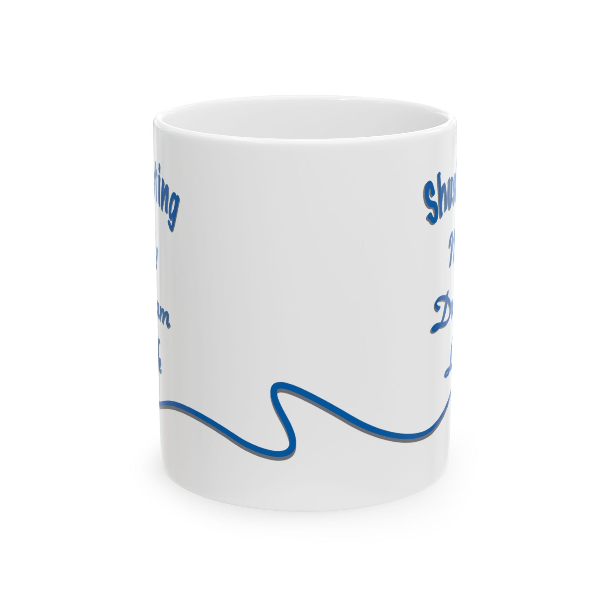 White ceramic mug with the text 'Shush, I'm Manifesting My Dream Life'

