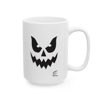 A white ceramic mug featuring a black graphic of a spooky ghost face, set against a plain white background.