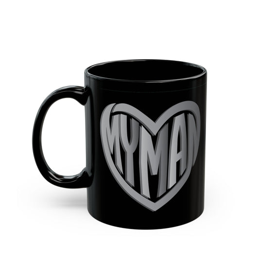 A glossy black ceramic mug featuring a large steal heart outline on the front with the word 'MYMAN' written inside in bold, stylized lettering.