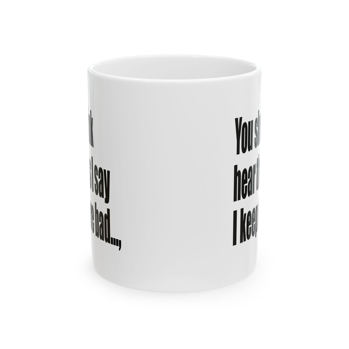 A white ceramic mug with black printed text on a clean white background.