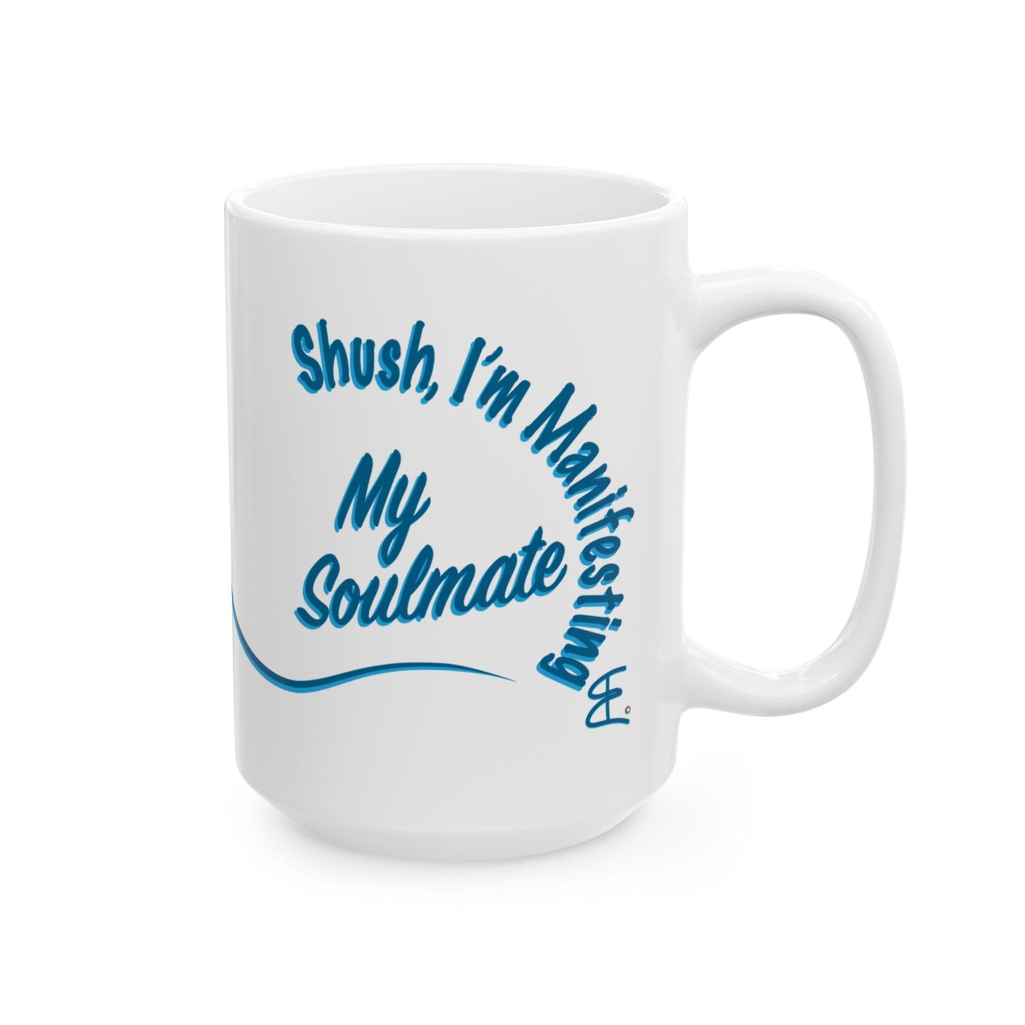 A white ceramic coffee mug with a blue printed graphic that reads 'Shush, I'm Manifesting My Soulmate' on a clean white background.