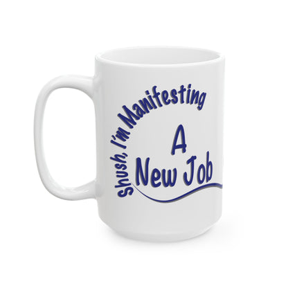 'Shush, I’m Manifesting A New Job' — 15oz ceramic mug  front view handle on left on white background
