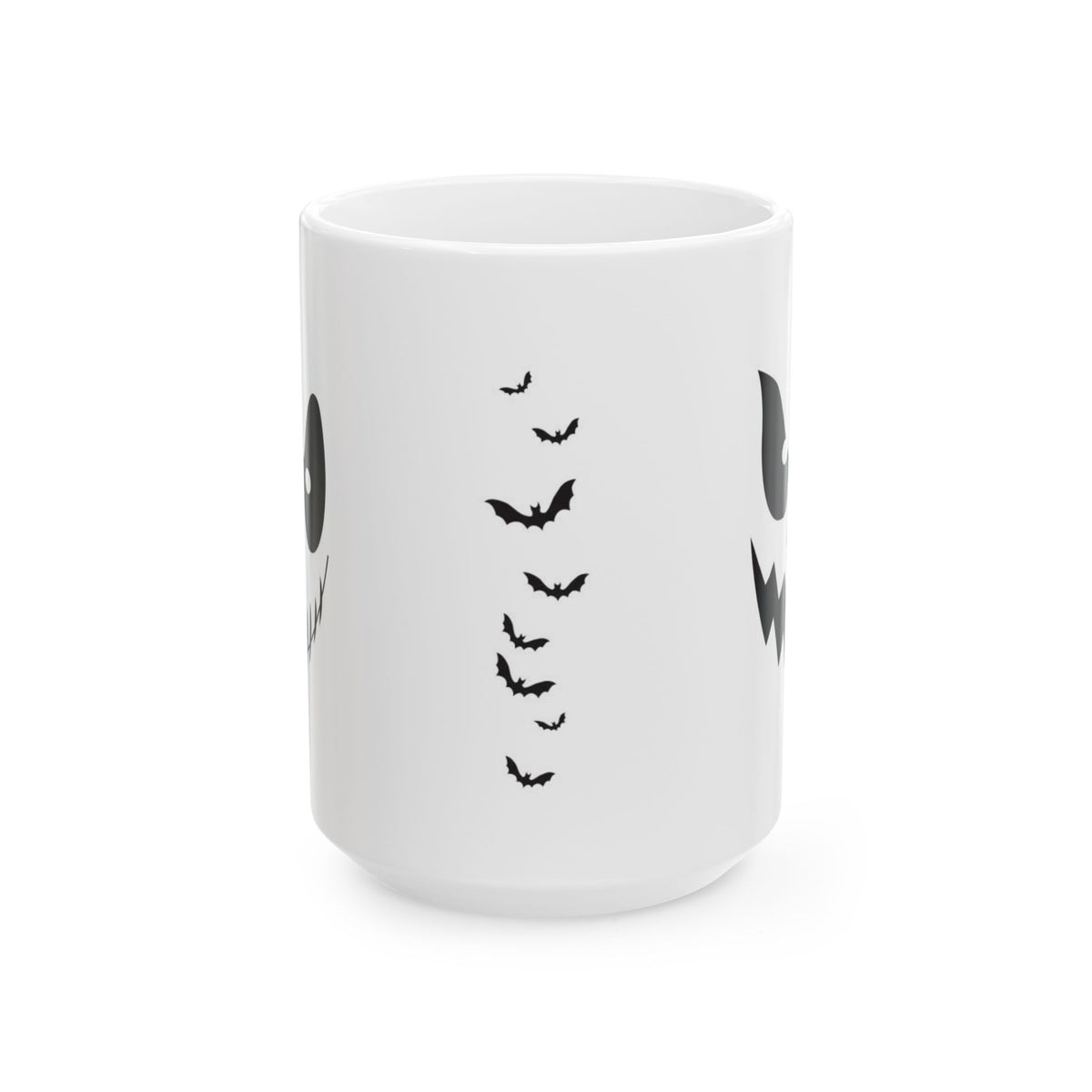 A white ceramic mug featuring a black graphic print of flying bats and partial ghost details shown on a clean white background.
