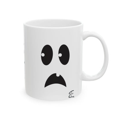A white ceramic mug featuring a minimalist black graphic of a sad ghost face with large eyes and a downturned mouth, set against a clean white background.