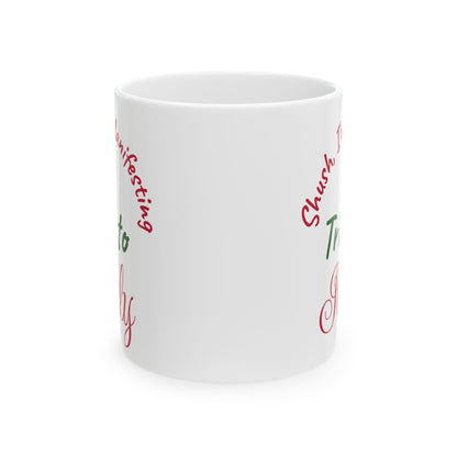 White mug with red and green text on a white background